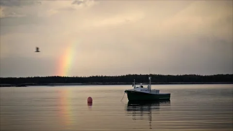 Rainbow over boat in harbor Stock Footage 165691728