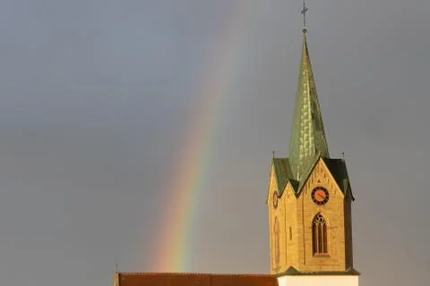Rainbow over church Stock Photos