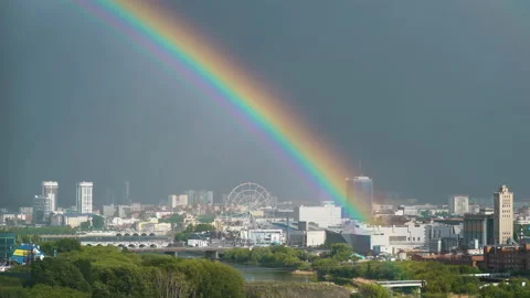Rainbow over the city. Bright and wide. Stock Footage