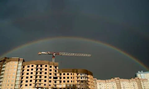 Rainbow over the city. Stock Photos