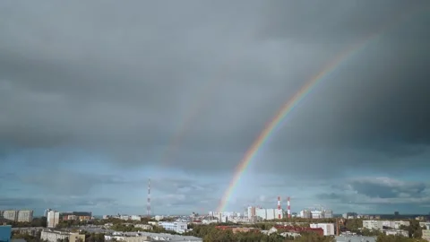 Rainbow over the city at sunset Stock Footage 209458326