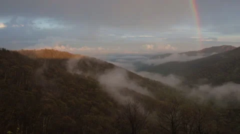 Rainbow Over Cloudy Valley Pan 2 Stock Footage 23604542