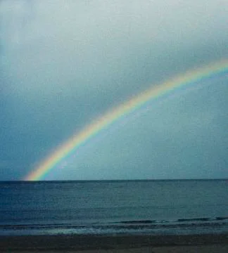 RAINBOW OVER COASTLINE Stock Photos