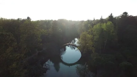 Rainbow over Devil's bridge in the park Kromlau, Germany, top view Stock Footage 77041061