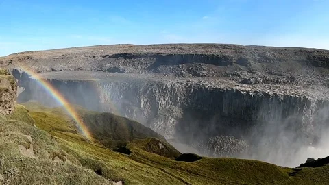 Rainbow over the edge of Dettifoss waterfall canyon in Iceland Stock Footage 333515082