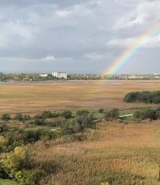 Rainbow over the field Stock-Fotos