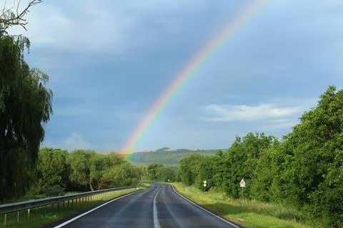 Rainbow over field Stock Photos