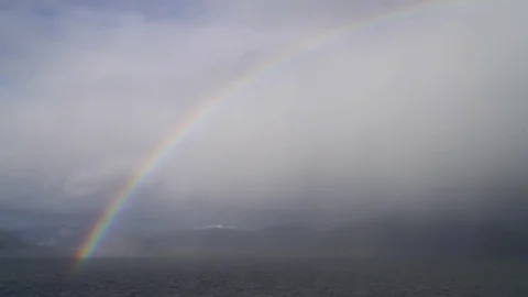 Rainbow over fjord Stock Footage 73246676