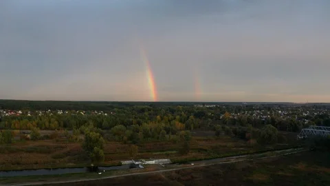 Rainbow over the forest at sunset. Aerial view. 库存影片 117059495