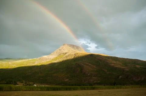 Rainbow over hills Stock Photos