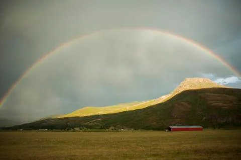 Rainbow over hills Stock Photos