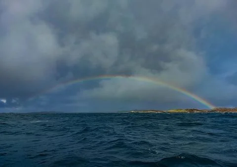 A rainbow over the Isle of Coll in Argyll and Bute, Scotland Foto stock