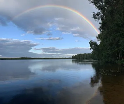 Rainbow over the lake Stock Photos