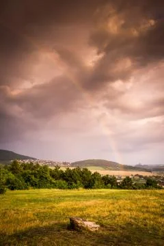 Rainbow over landscape Stock Photos