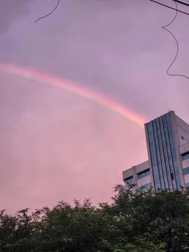 Rainbow over modern building Stock Photos