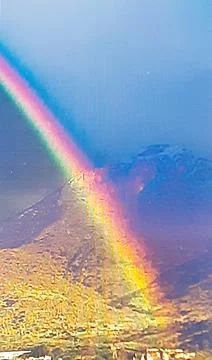 A rainbow over the mountain Stock Photos