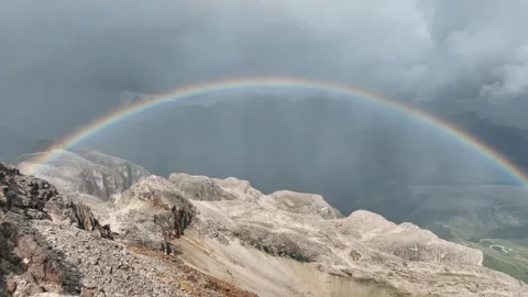 Rainbow over the mountains to the edge of the precipice, 4k Stock Footage 254583493