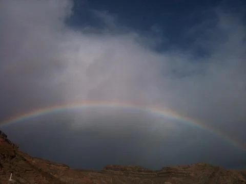 Rainbow over the mountains Stock Photos