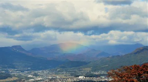 A rainbow over the mountains Stock Photos