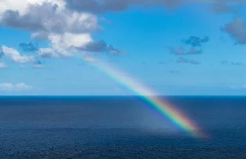Rainbow over the ocean Stock Photos