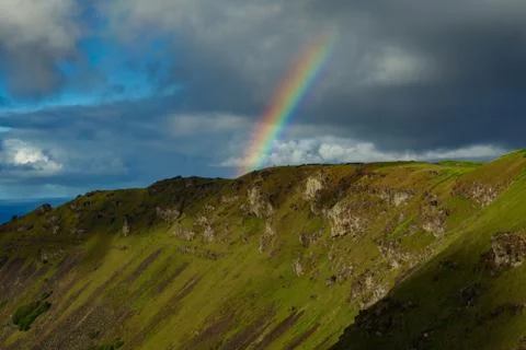 Rainbow over Orongo town in Easter Island Stock Photos
