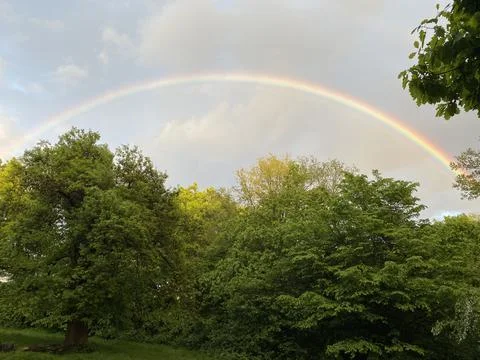 A rainbow over a park Stock Photos