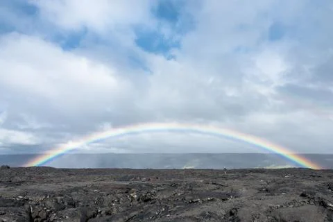 Rainbow over recent basalt flows in Hawaii Volcanoes National Park Stock Photos