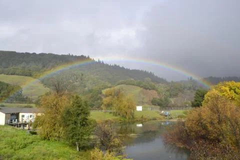 Rainbow Over River Foto stock