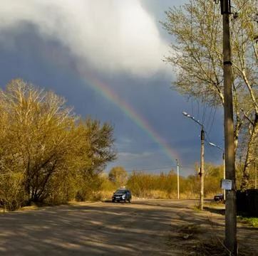 Rainbow over road Stock Photos