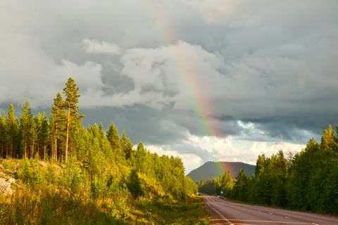 Rainbow over road Stock Photos