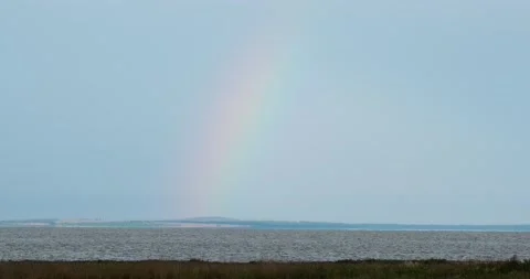 Rainbow over the sea after rain Stock Footage 133721034