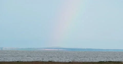 Rainbow over the sea after rain Stock Footage 133721166