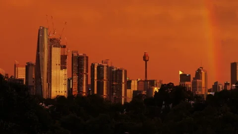 A rainbow over Sydney cityscape during sunset zoom out 4K Stockbeeldmateriaal 236813332