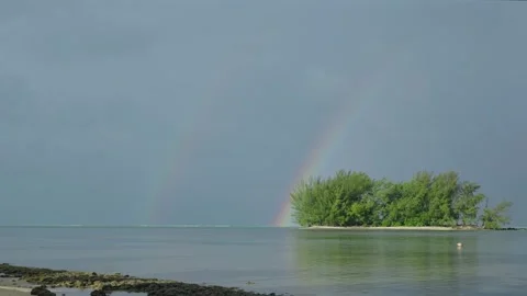 A Rainbow Over a Tiny South Pacific Island Stock Footage 317121654