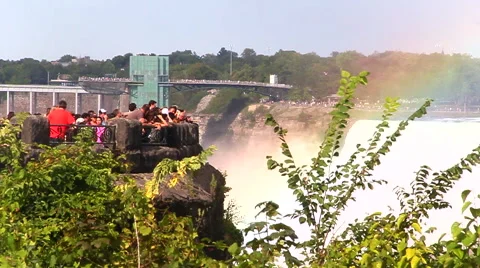 Rainbow over walking tourists Видео 41823699