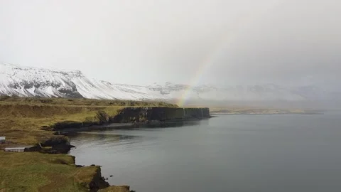A rainbow over a waterfall in Iceland Stock Footage 168257690