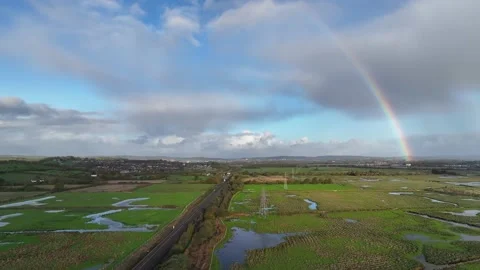 Rainbow over Wetlands from a drone, RSPB Exminster and Powderham Marshe Stock Footage 221647101