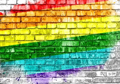 A rainbow painted on a brick wall Foto stock