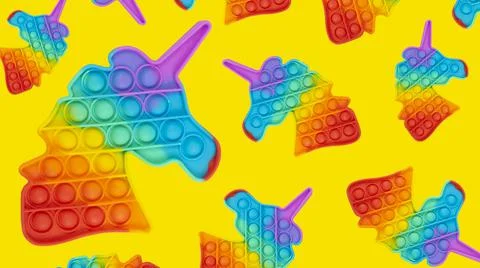 Rainbow pattern simple dimple in the form of a unicorn on yellow background Stock Photos