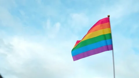 Rainbow Pride Flag with Copy Space on Blue Sky Stock Footage 340034613