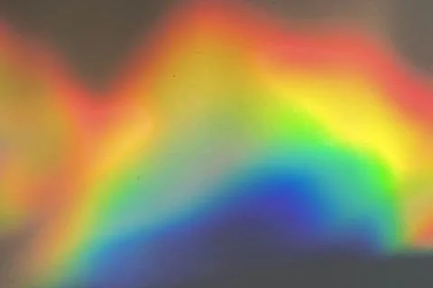 Rainbow prism reflected through water creates vibrant wavy image 17 Stock Photos