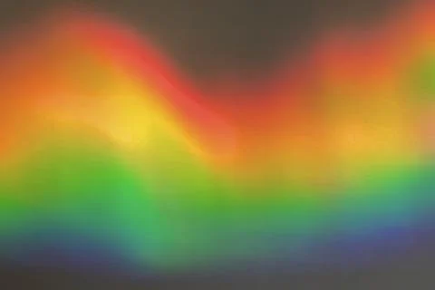 Rainbow prism reflected through water creates vibrant wavy image 14 Foto stock