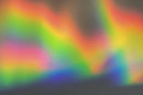 Rainbow prism reflected through water creates vibrant wavy image 13 Stock Photos