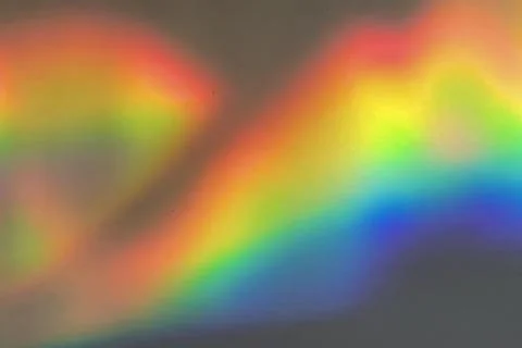 Rainbow prism reflected through water creates vibrant wavy image 12 Stock-Fotos