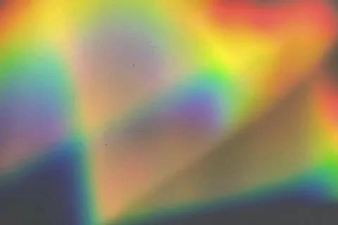 Rainbow prism reflected through water creates vibrant wavy image 10 Stock Photos