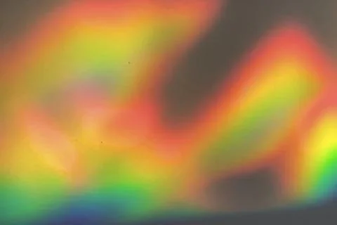 Rainbow prism reflected through water creates vibrant wavy image 9 Stock Photos