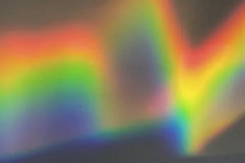 Rainbow prism reflected through water creates vibrant wavy image 8 Stock Photos