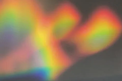 Rainbow prism reflected through water creates vibrant wavy image 5 Stock-Fotos