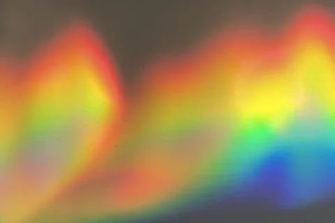 Rainbow prism reflected through water creates vibrant wavy image 4 Stock Photos