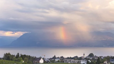 Rainbow, Rain and Sun over Geneva Lake -  Two Switzerland Timelapse in one ! Stockbeeldmateriaal 97900850